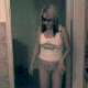 A blonde woman takes a shit into a toilet in two separate scenes. She pulls her panties aside without pulling them down to allow for the shit to easily slide out. There is poor lighting in this clip, but you can still see the action.